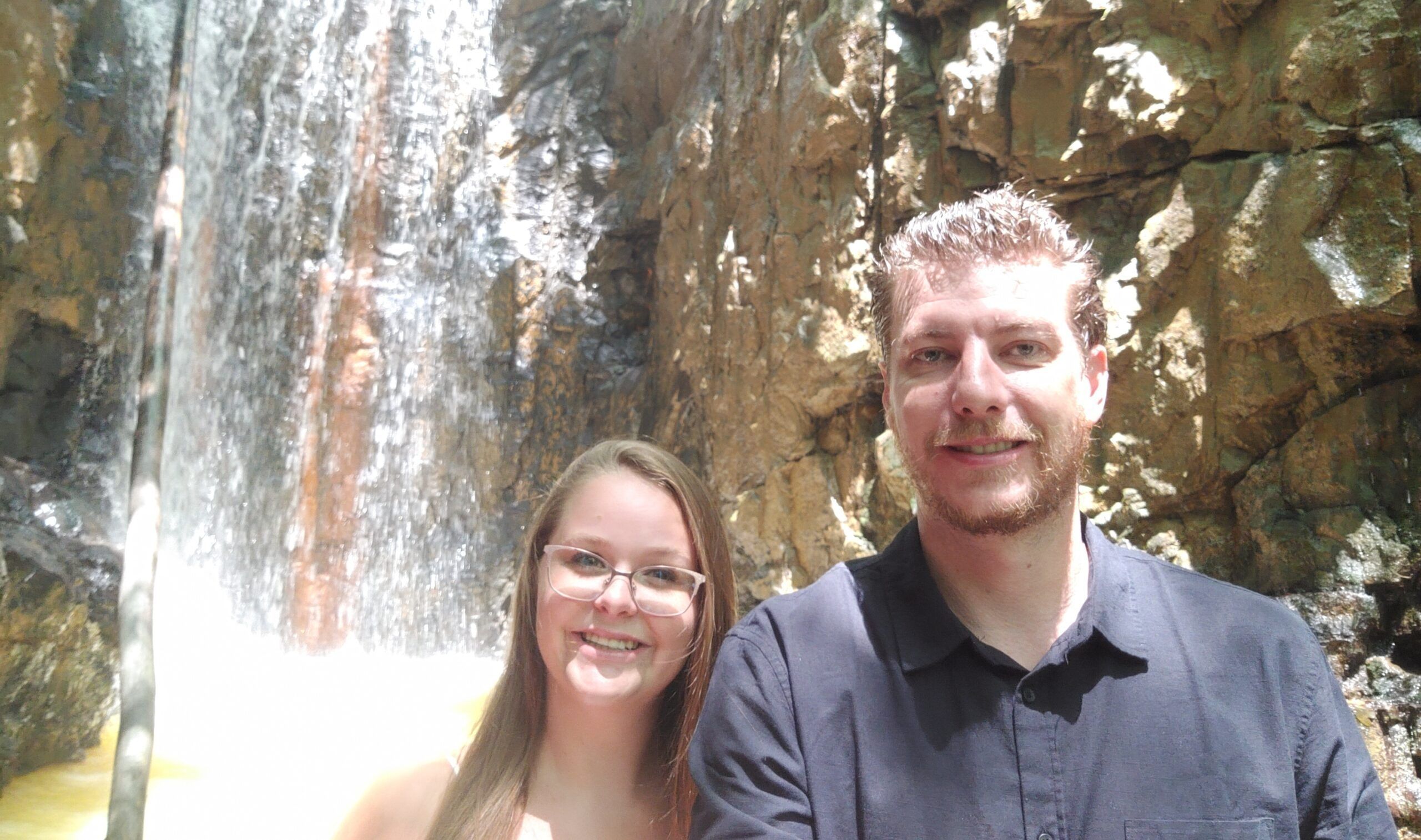 Katelyn and Peter in front of a waterfall